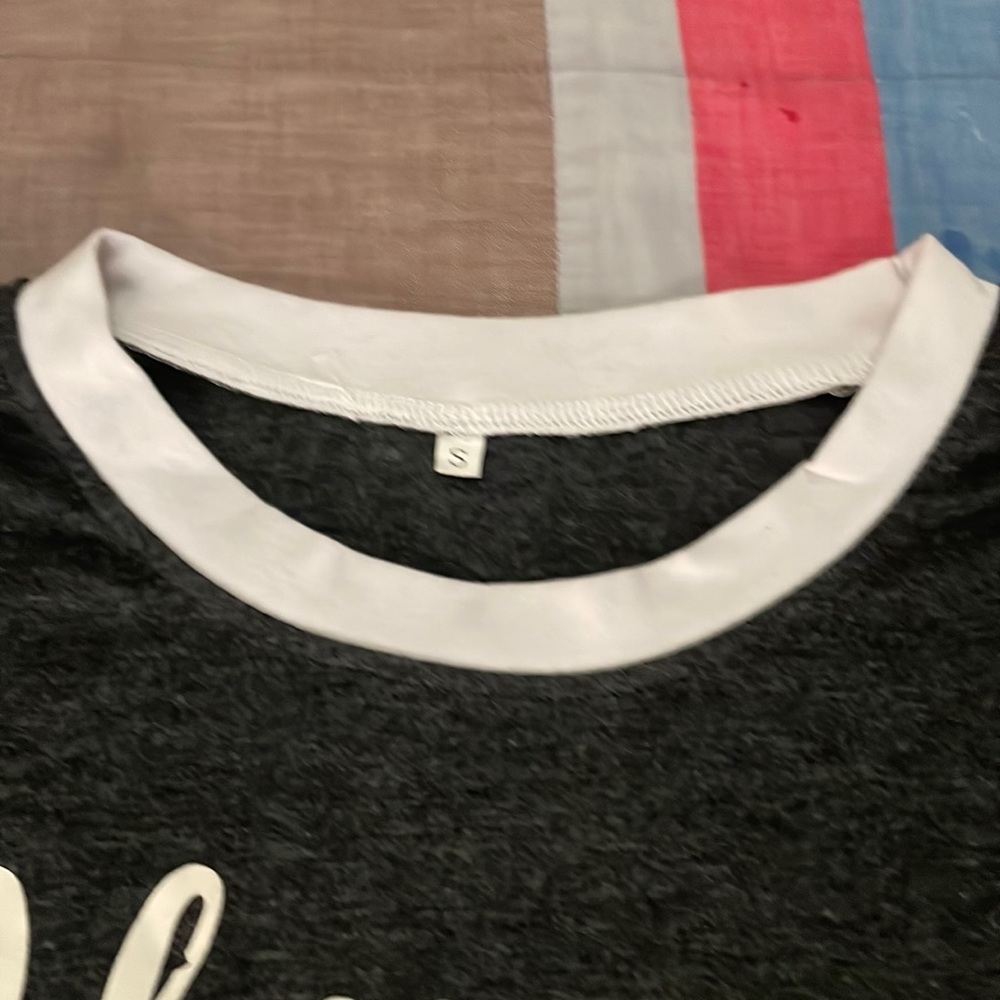 T shirt that reads “Happy Camper”